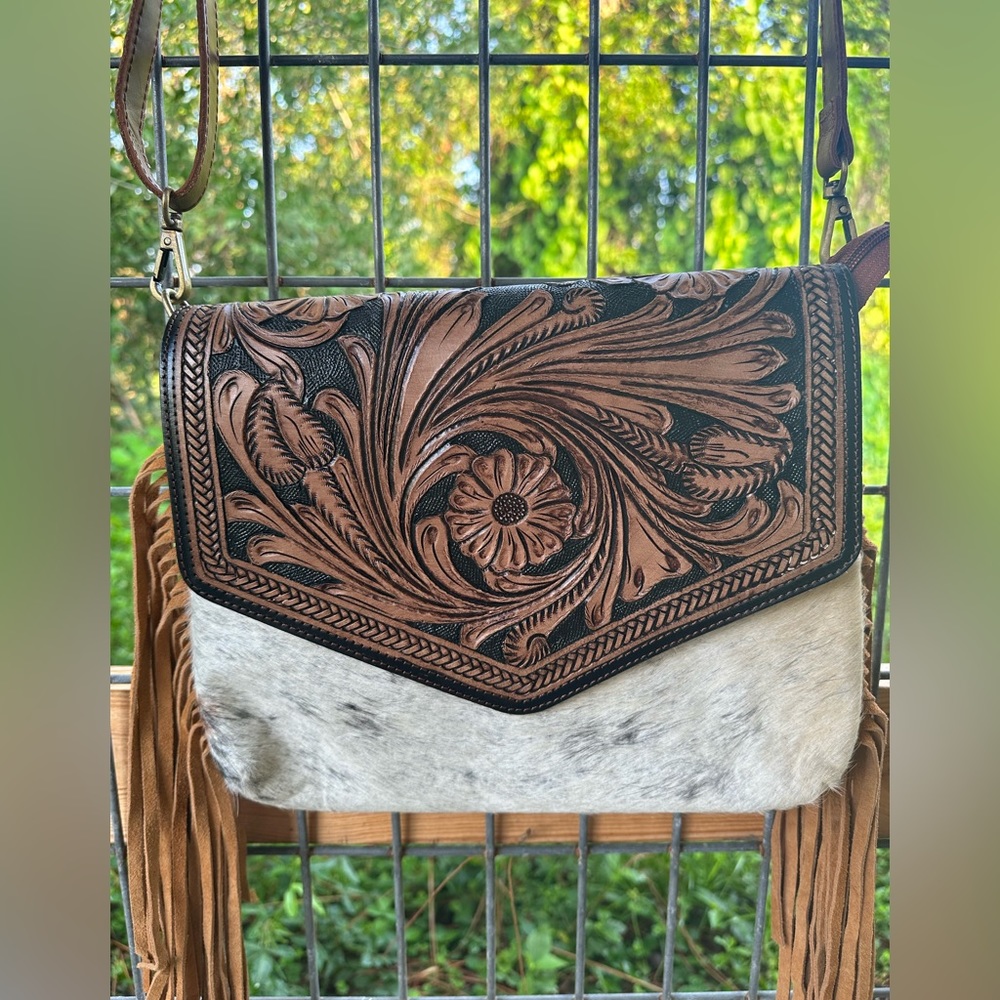 Tooled leather w/ fringe and cowhide